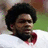 Red background with yellow text memorializing Sean Taylor, featuring a photo of a man in a white jersey with a red collar.