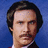 Pixelated image of a man with dark hair and mustache against blue background, paired with text "you stay classy" on top right and partial words "planet earth" below.