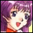 Pixelated anime-style character with purple hair and blue eyes, mouth open in a smile, wearing an orange garment against a black background with white text.