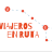 Pixelated red text reads 'JUGADORES EN RUTA' on light gray background with red and blue pixel clusters forming a curved line above the text.