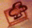 Five variations of a stylized four-leaf clover icon within a square frame, each in distinct solid colors against matching background hues.