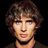 Pixelated image of a person with brown hair and light eyes, red text reading "Singer Song Writer Base Player AND...... HOTTIE!!!" on black background.