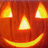 Animated pumpkin face with glowing eyes and mouth, transitioning from no text to 'Happy Halloween' in yellow pixelated font.