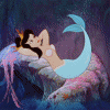 Animated mermaid with light blue tail and pink hair rests on a dark blue background, head turned left to right.