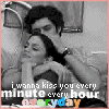 A black-and-white animated sequence shows a man styling a woman's hair with a brush, while text overlays read "i wanna kiss you every minute every hour everyday" in multicolored letters.