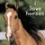 A static pixelated image of a light brown horse's head with a white blaze on its face, positioned against a blurred green and black background.
