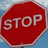Red octagonal stop sign with white text on blue sky background, one version has overlaid black text reading "NO u stop wen the thingys r flashing on da bus!!".