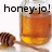 A pixelated image shows a glass jar of honey with a wooden dipper, and the text 'honey-jo!' in bold black letters above it.