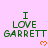 Pixelated text 'I LOVE GARRETT' in green on pink background with orange heart below, partially cropped at bottom right.