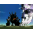 Pixelated animation of dark mechanical creatures on grassy terrain under blue sky, with smoke and debris effects.
