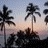 Pixelated beach scene with palm trees, sunset sky, and text 'SUMMER 06' featuring a white heart symbol that changes position between frames.