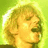 Pixelated close-up of a person with curly blonde hair against a bright green background, showing partial facial features and neck.