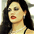 A pixelated 50x50 buddy icon featuring a woman with long dark hair, red lipstick, and pearl necklace on the left side, next to green text reading "Original Icons .com" on a solid green background.