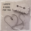 A grayscale pixelated image shows a hand holding a cassette tape with text reading "I WROTE A SONG FOR YOU" on the left side.