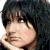 A 3x2 contact sheet of five animated frames showing Ashlee Simpson in various poses with a central text label, displayed on a gray background.