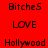 Red background displays two of pixelated text reading BitcheS, LOVE, Hollywood, BitcheS, LOVE, Hollywood in sequence