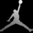 Pixelated grayscale silhouette of a basketball player mid-air with one arm extended upward holding a ball, legs spread in a jumping pose against black background.