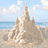 Pixelated beach scene with sandcastle, ocean, and sky on left; cyan background with yellow text 'julia', 'is', 'awesome' on right.