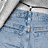 Animated contact sheet showing a woman in blue denim shorts and black strappy top across seven frames with visible motion blur on hair and limbs, plus static text at bottom left.