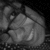 A grayscale animated icon shows a hand holding a rounded object with a curved line detail, transitioning from left to right.