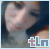 A pixelated image of a person with dark hair and light skin, wearing a light-colored top, with a 'tLn' logo in the bottom right corner.
