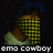 Pixelated image of a character in green and brown clothing with yellow checkered patterns, set against dark background with text "emo cowboy" at bottom.