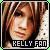 Pixelated static image of a person's face with text "KELLY FAN" at the bottom, framed by dark hair and light background elements.