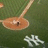 Pixelated baseball field view with NY logo and text 'where all the legends played' and 'yankee stadium' on dark green and gray