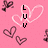 Pink background with pixelated heart outlines and text elements including 'LUV' and 'spells LOVE' in black block letters.