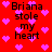 Red background with pink pixelated hearts and black text reading "Briana stole my heart" in four repeated sections.