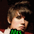 Pixelated portrait of a person with brown hair and red-and-white clothing, featuring green text labels below the face.