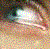 A pixelated close-up of a person's eye with tears, accompanied by text reading 'Ask Me About My TEARS' in white block letters.