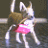 Pixelated figure with light brown hair, white top, and pink skirt in a dynamic pose against dark background.