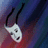 Pixelated white mask with black eyes and mouth hangs from black string against blurred purple and red background.