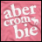 Pixelated pink background with white text reading 'abercrombie' in a stylized font.