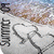 Pixelated icon with vertical text on left, abstract shapes in center-right, and blurred background colors including blue, brown, and white.