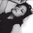 Black-and-white photo of a person with dark hair lying down, next to green text reading 'Original Icons .com' on a solid background.