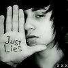 Black-and-white image of a person holding a hand up with 'Just Lies' written on the palm, face partially visible in profile.