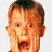 A pixelated image of a child with hands on cheeks, next to blue background with cyan text reading 'guess why he has scored the mirror he ask himself' in fragmented style.
