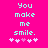 Bright pink background with cyan pixelated text reading "You make me smile." and five white/pink heart symbols below.