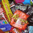 Pixelated candy pile with text "Want Candy!" on colored , blue with black vertical bar