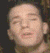 A four- shows a person's face with closed eyes, mouth slightly open in the top-left and pursed lips in others, against dark background