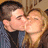 A four- with a pixelated photo of two people kissing, text in blue and black backgrounds, and an orange showing a date
