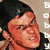 A pixelated image of a person with dark hair and red skin tone, wearing black clothing, with vertical white text reading "Bobby" on the right side.