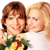 Static 50x50 pixel icon showing two women with brown and blonde hair in close proximity, one holding a bouquet of flowers against a white background.