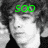 A black-and-white image of a person with curly hair, featuring green text overlays that change across four