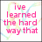 Pixelated pink text on white background with pastel swirls, displaying two sequential phrases.
