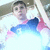 Pixelated image of a person in mid-air with arms extended, wearing white shirt and blue pants against light background.