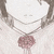 A pixelated heart-shaped icon with a pinkish-red gem pendant on a chain, set against a light background.