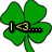 Green four-leaf clover with text overlays celebrating St. Patrick's Day, featuring pixelated text and a heart symbol on a white background.